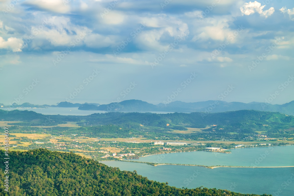 Panoramic view of blue sky, sea and mountain seen from Cable Car viewpoint, Langkawi, Malaysia. Picturesque landscape with beaches, small Islands and tourist ships at waters of Strait of Malacca