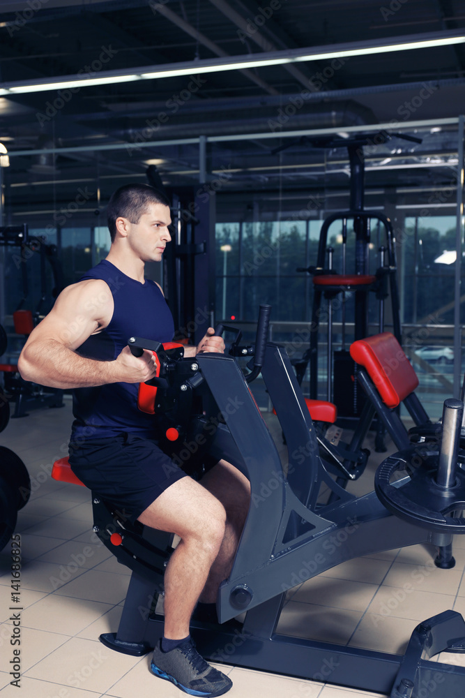 Young handsome man training in gym Young handsome man training in gym