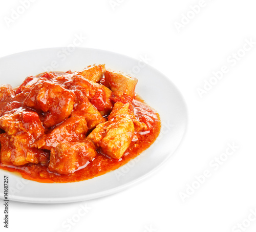 Plate with delicious chicken tikka masala isolated on white