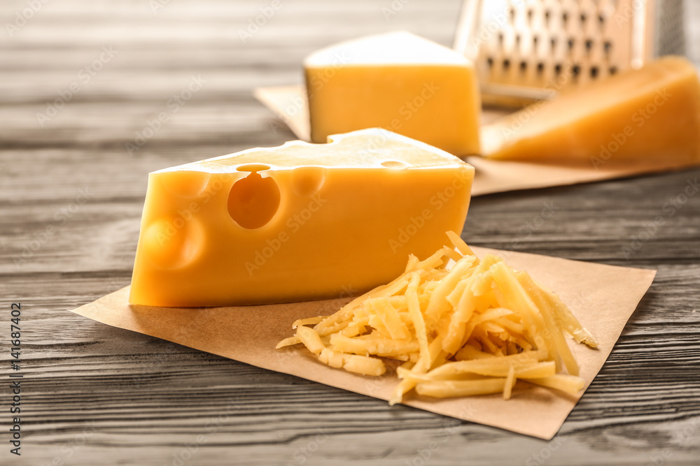Tasty cheese on wooden table