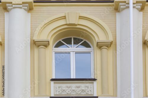Arched window with decorated wall background