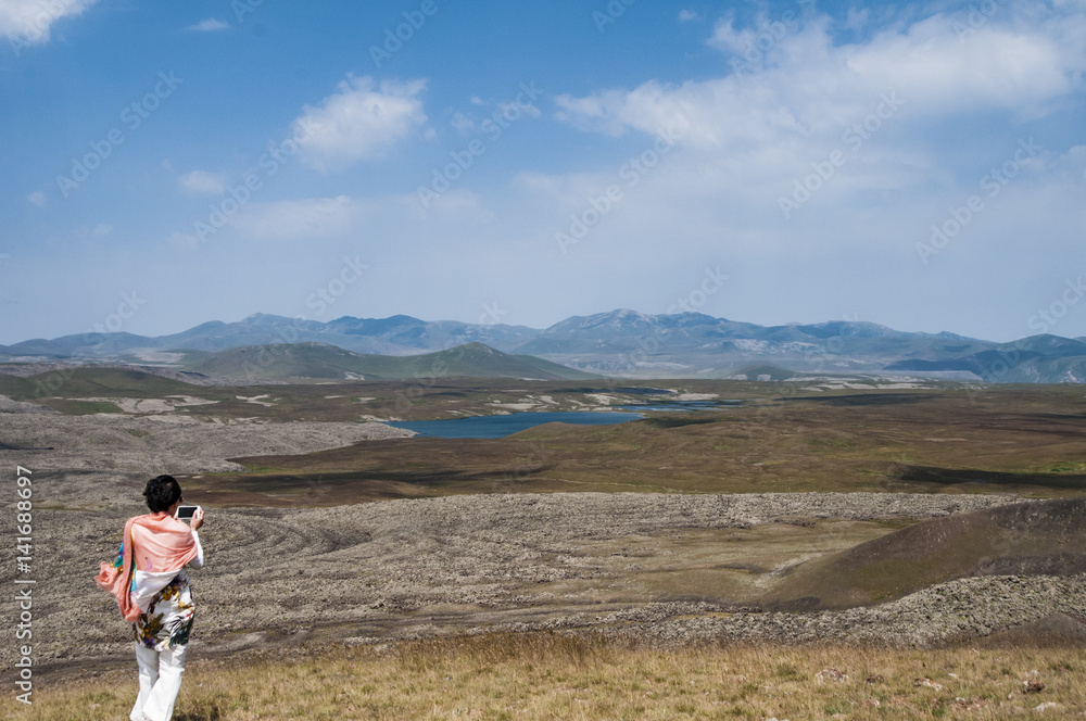 Fototapeta premium Syunik Plateau, Armenia: looking out over the petroglyph fields of Ughtasar