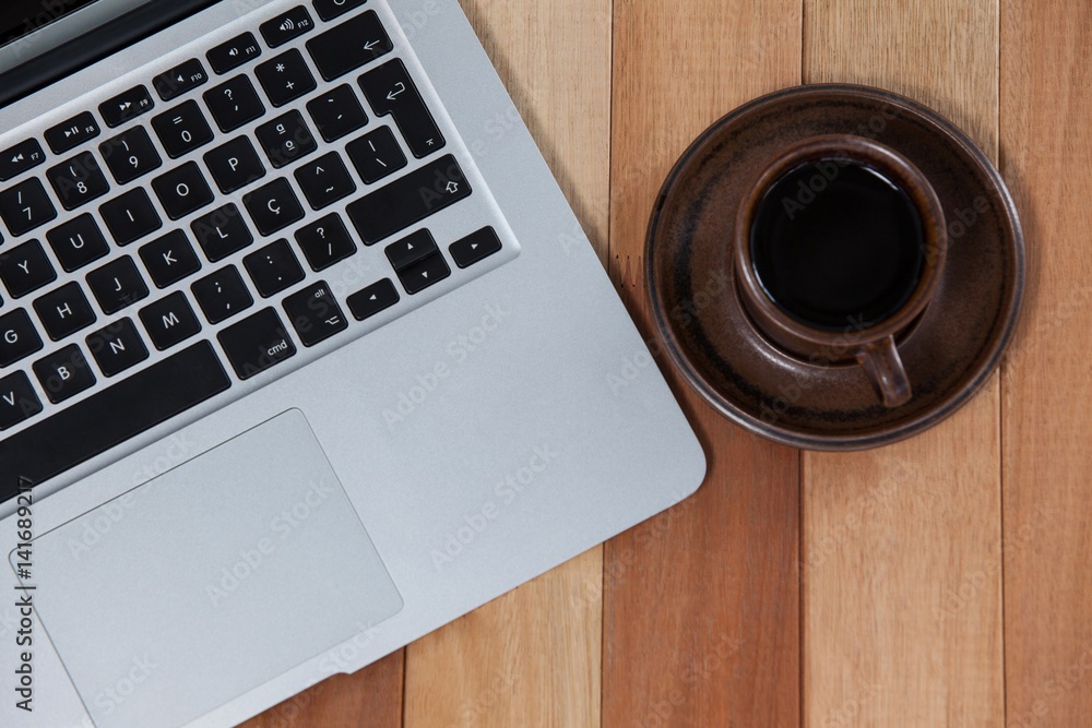 Cup of black coffee and laptop Cup of black coffee and laptop
