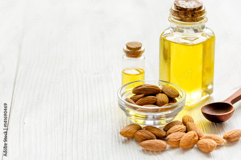 spa with almond oil in organic cosmetic set on white background spa with almond oil in organic cosmetic set on white background