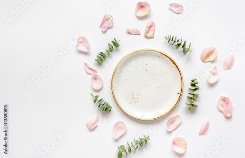Spring trandy design with plate and blossom white background top view mockup