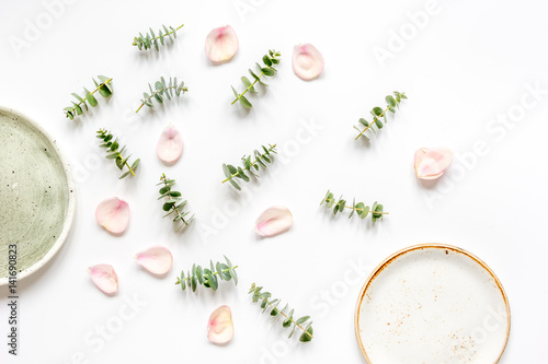 breakfast plate with petals and eucalyptus on white background top view mockup