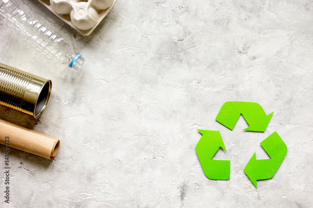 waste and recycling symbol in eco care on stone top view waste and recycling symbol in eco care on stone top view