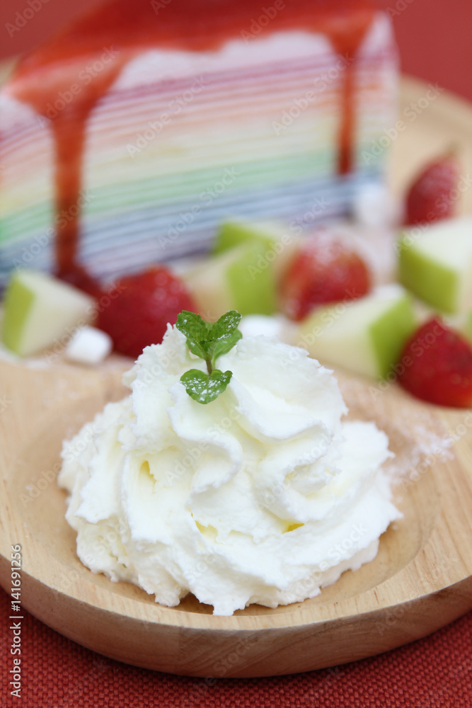 Whipped cream on wooden plate. Whipped cream on wooden plate.
