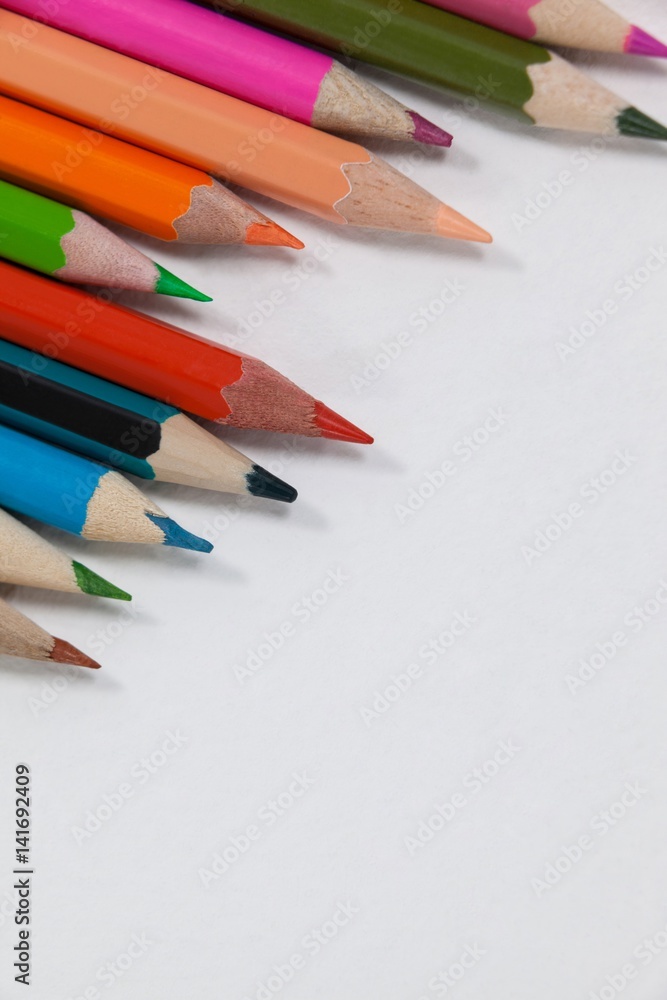Close-up of colored pencils arranged in a wave pattern Close-up of colored pencils arranged in a wave pattern