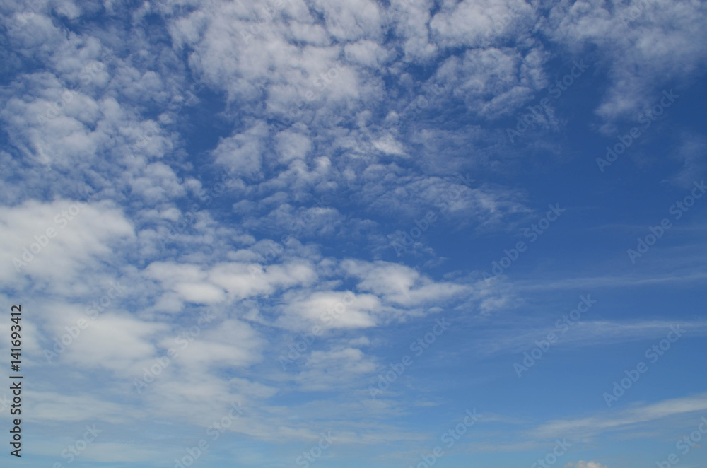 Blue sky with white fluffy clouds