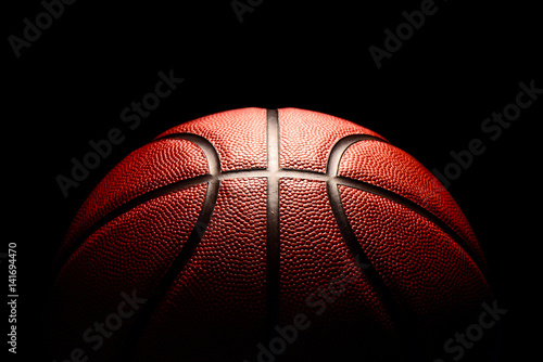 Fotografie, Obraz basketball on black background.