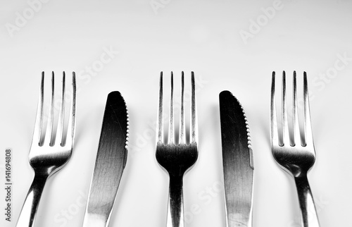 Forks and Knives isolated on bright background