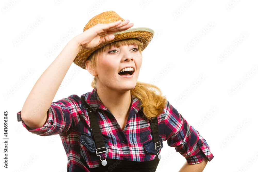 Woman wearing sun hat looking at something Woman wearing sun hat looking at something