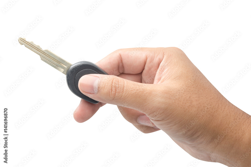 Hand holding key isolated on white background Hand holding key isolated on white background