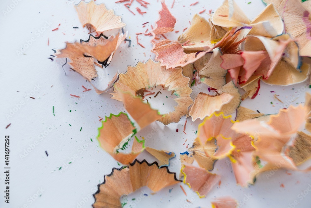 Colored pencils shavings on a white background Colored pencils shavings on a white background
