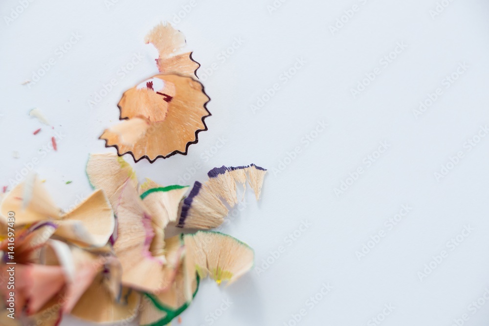 Colored pencils shavings on a white background Colored pencils shavings on a white background