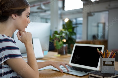 Female graphic designer using laptop Free Download Female graphic designer using laptop - GFXLoad