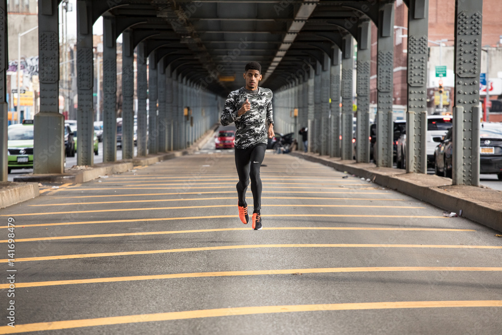 A young man goes running in the cold weather of Brooklyn, NYC