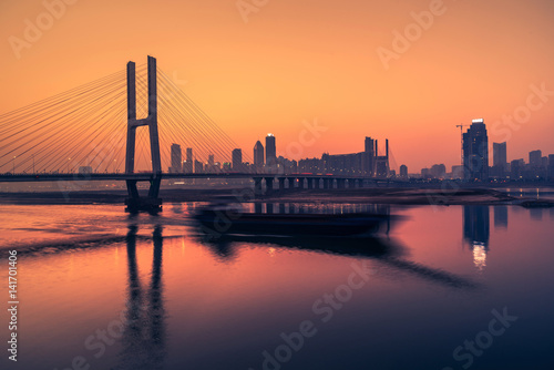 sunset view of cityscape along riverside,located in China.