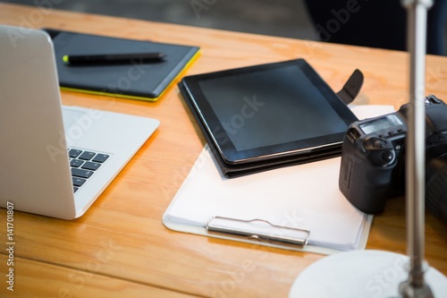 Laptop, digital tablet and digital camera on desk