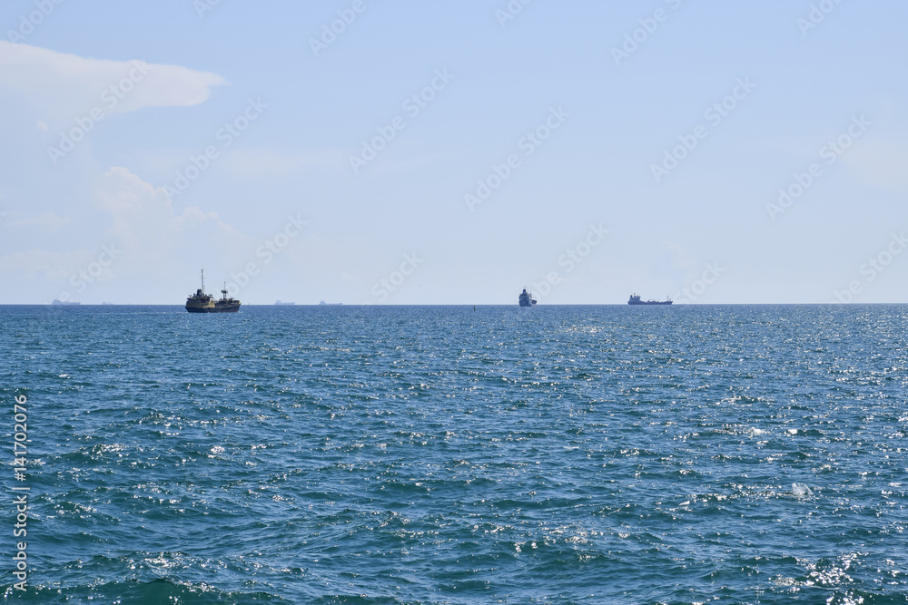 Ships on the horizon of the sea. Out at sea ships