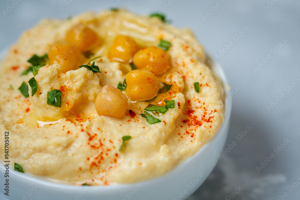 Traditional hummus with herbs and paprika. Love for a healthy vegan food concept