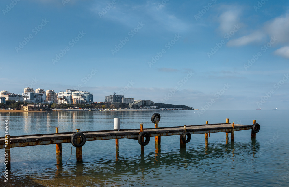 Obraz premium The berth of the rescue station against the background of the sea bay and the cape 
