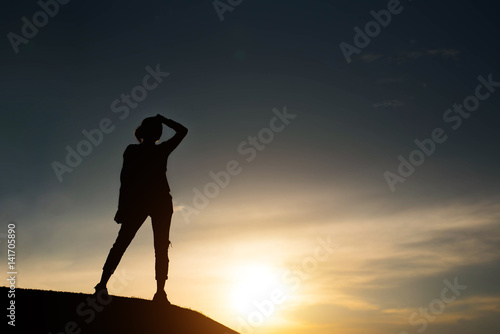 Fototapeta Naklejka Na Ścianę i Meble -  silhouette mountaineer a concept and sunset