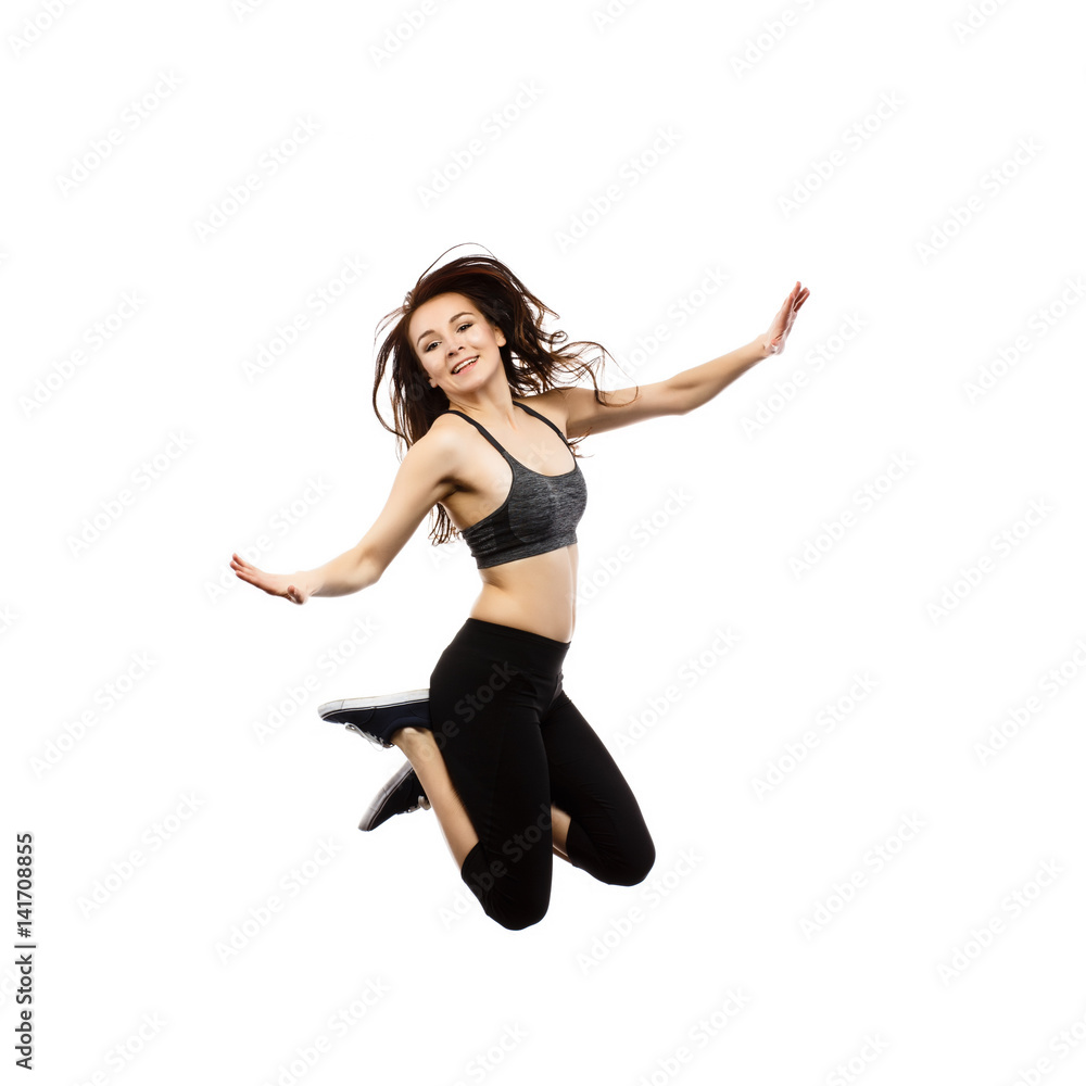 Young woman jumping isolated on white