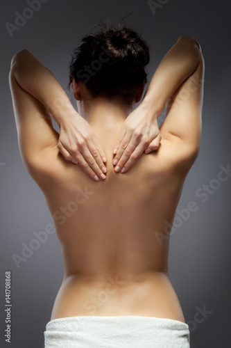 Woman massaging back pain