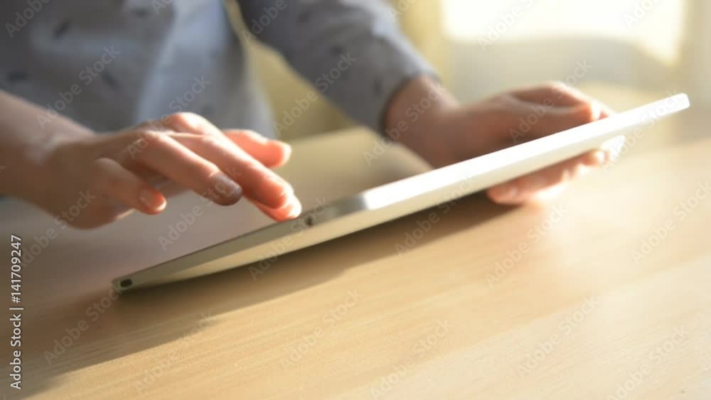 hand touching tablet computer surface touchscreen
hand touching tablet computer surface touchscreen