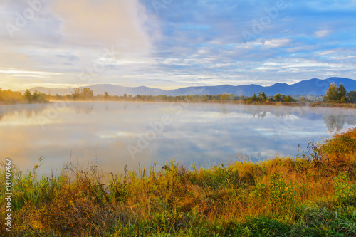 Lake in the mountains for recreation and fishing. Early morning