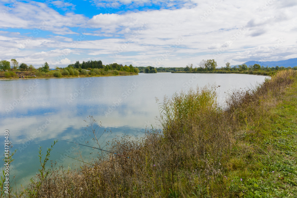 Lake in the mountains for recreation and fishing. Early morning