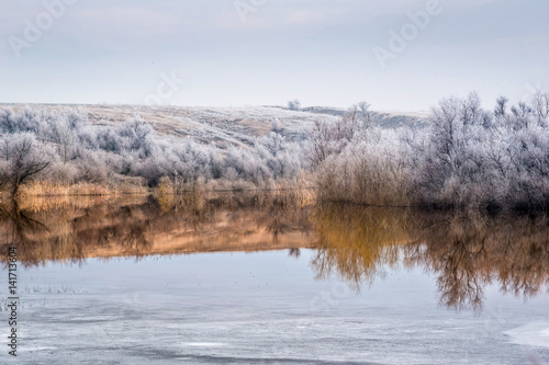 View of the lake  where the winter merges with early spring.