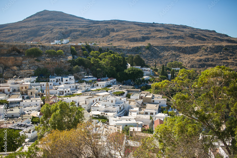 RHODES, GREECE: Aerial view over white town and trees