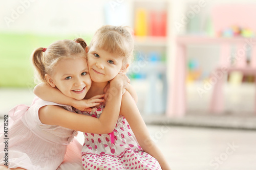 Adorable little girls in be...
