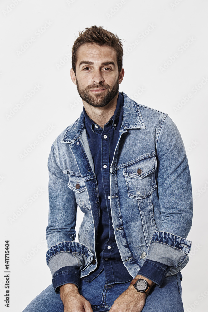 Portrait of man in denim jacket, smiling Portrait of man in denim jacket, smiling