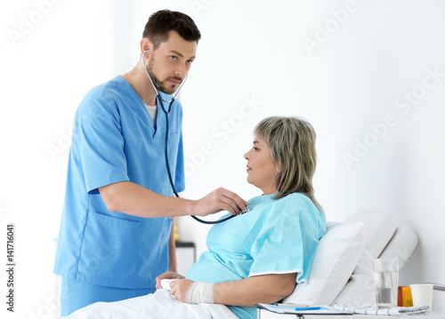 Doctor visiting patient in ...