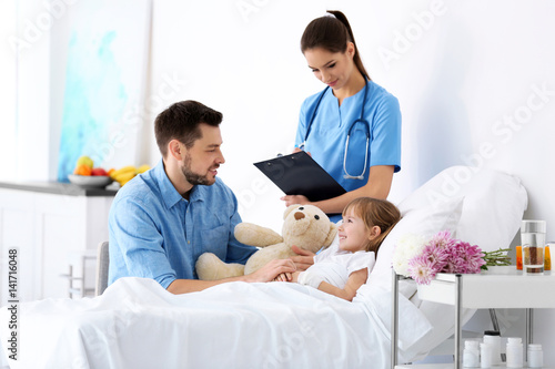 Father visiting little daug...