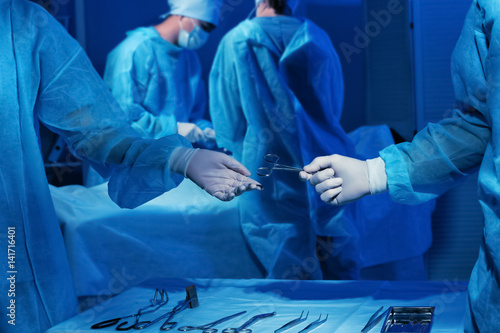 Hands of doctors holding me...
