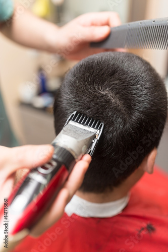 Man's haircut trimmer in the beauty salon