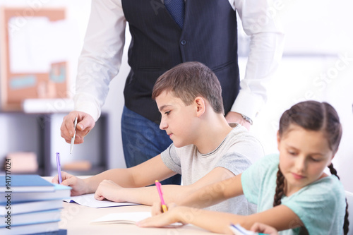 Male teacher conducting lesson in classroom