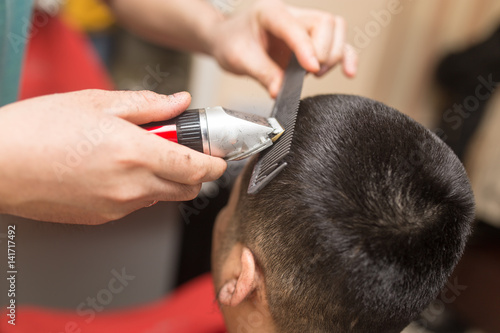 Man's haircut trimmer in the beauty salon