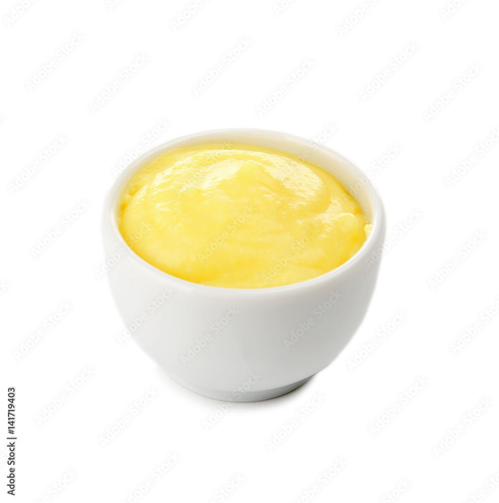 Creamy cheese in small bowl, isolated on white