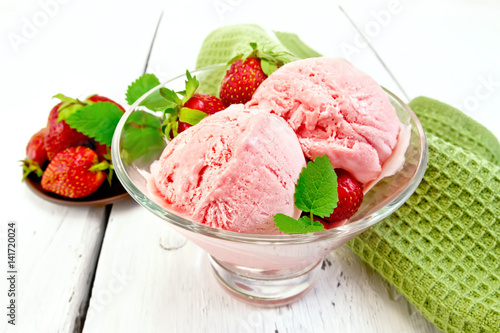 Ice cream strawberry in glass with mint on board