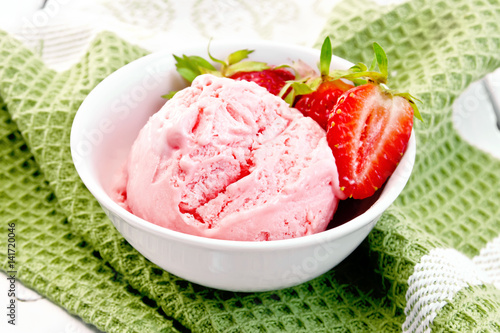 Ice cream strawberry with berries in bowl on napkin