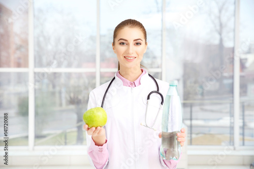 Young female nutritionist i...