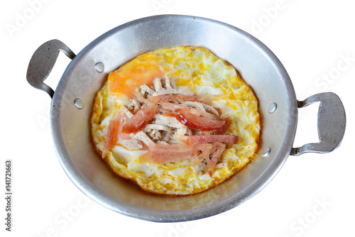 Fried egg in pan with white pork sausage