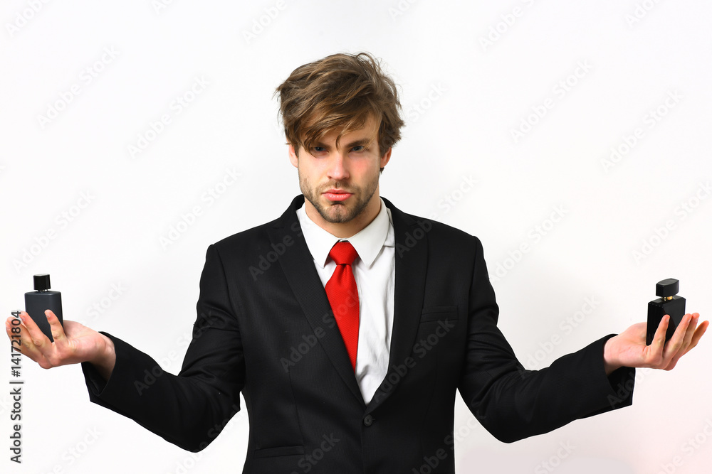 Caucasian stylish business man posing with perfume Caucasian stylish business man posing with perfume