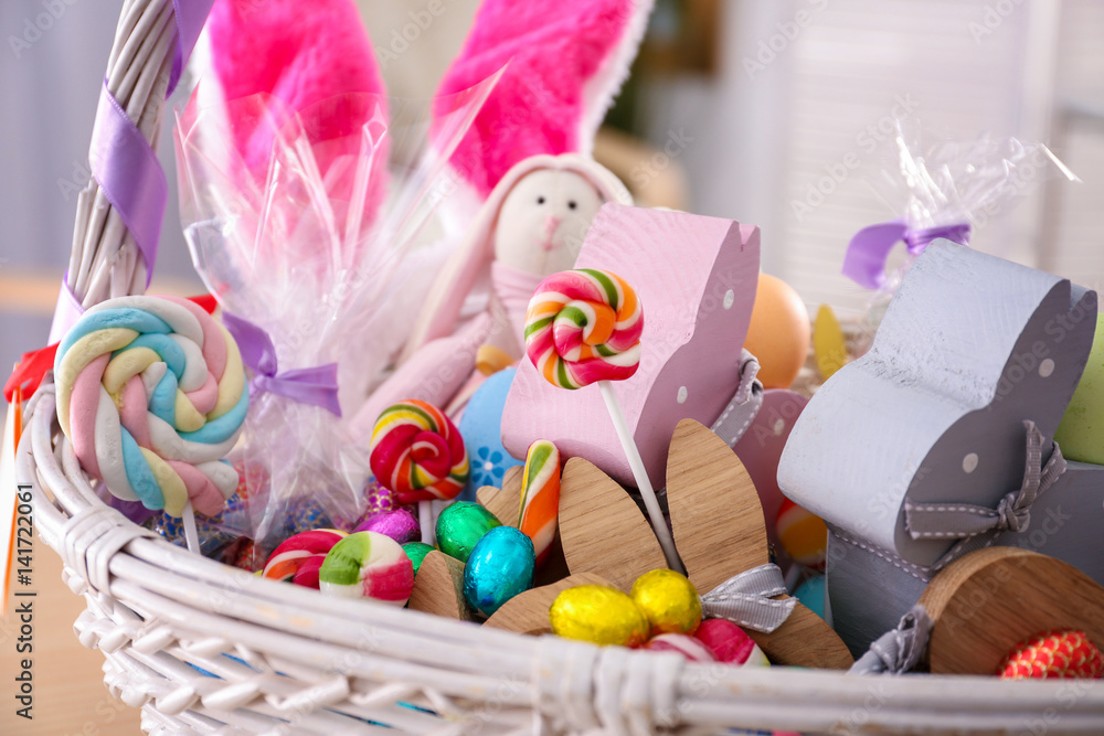 Beautiful Easter basket with traditional decorations and treats, close up